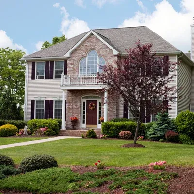 traditional two story home with nice front yard